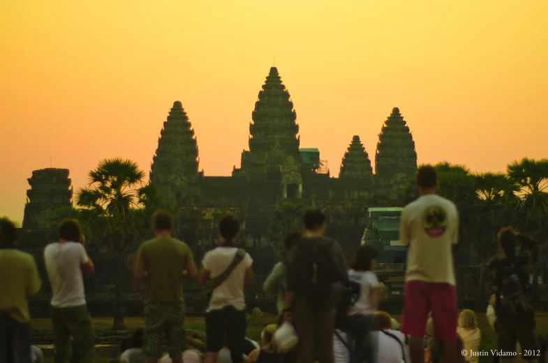 a crowd of people are standing in front of a building