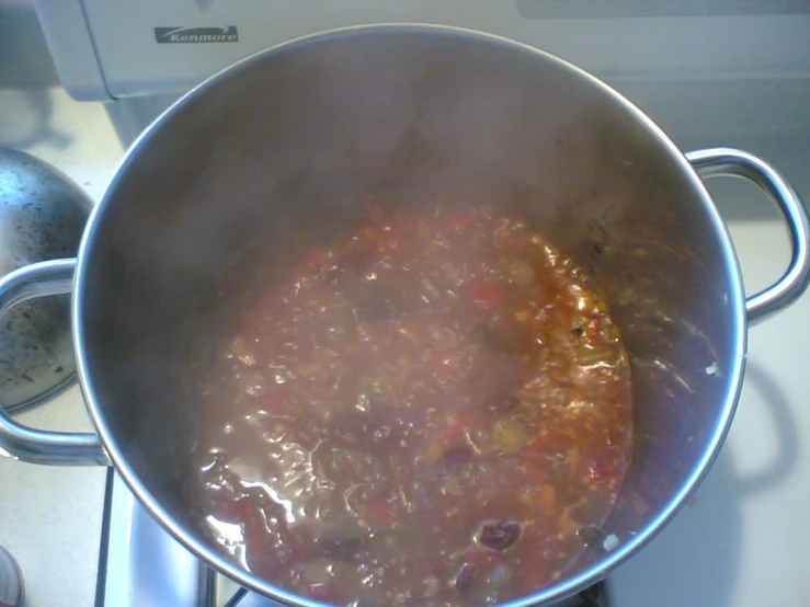 food cooking in a pot on a stove