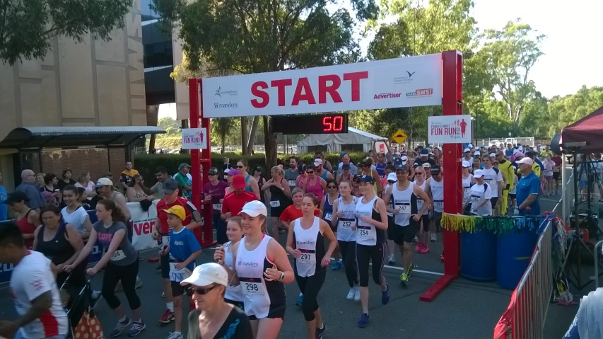 a group of people running in a half marathon