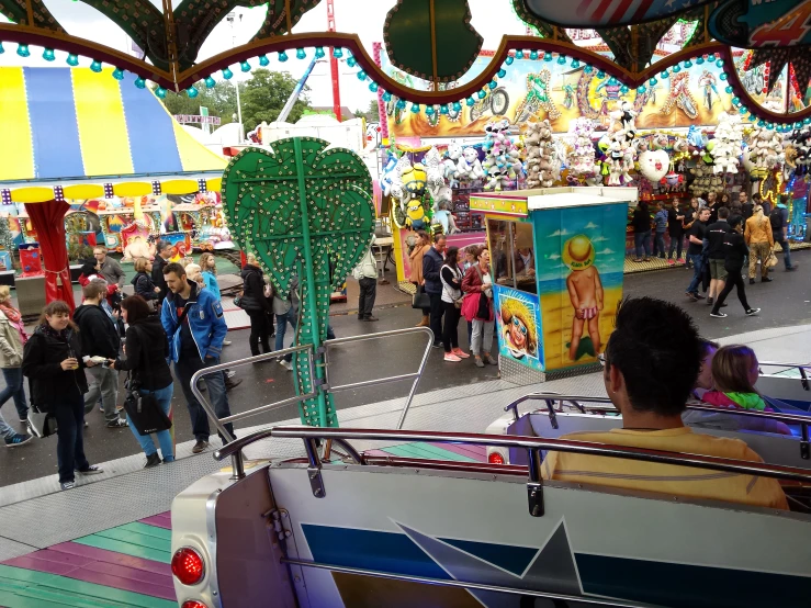 carnival rides with rides and people on the rides