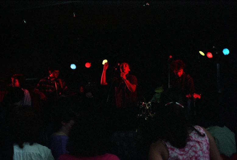 a group of people sitting on top of a stage