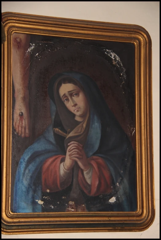 an ornate painting of a person holding a cross