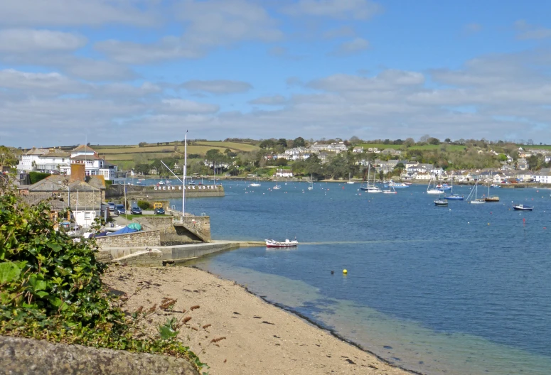 boats are out in the open water at a marina