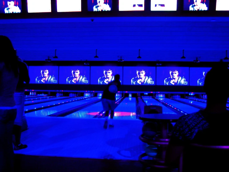 the bowling alley has blue lights all over it