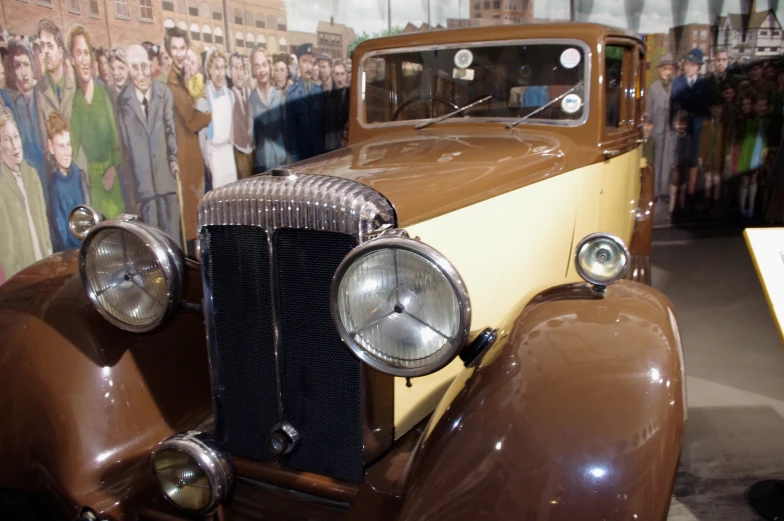 a very old fashioned car in a museum