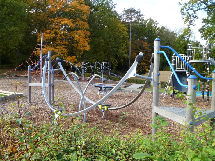 an empty play ground with a slides in it