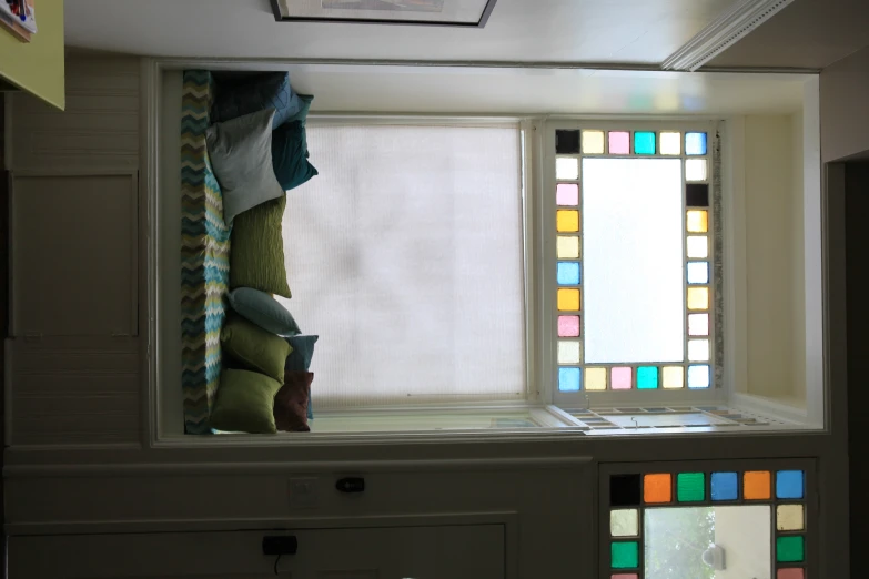 a white room has colorful stain glass windows