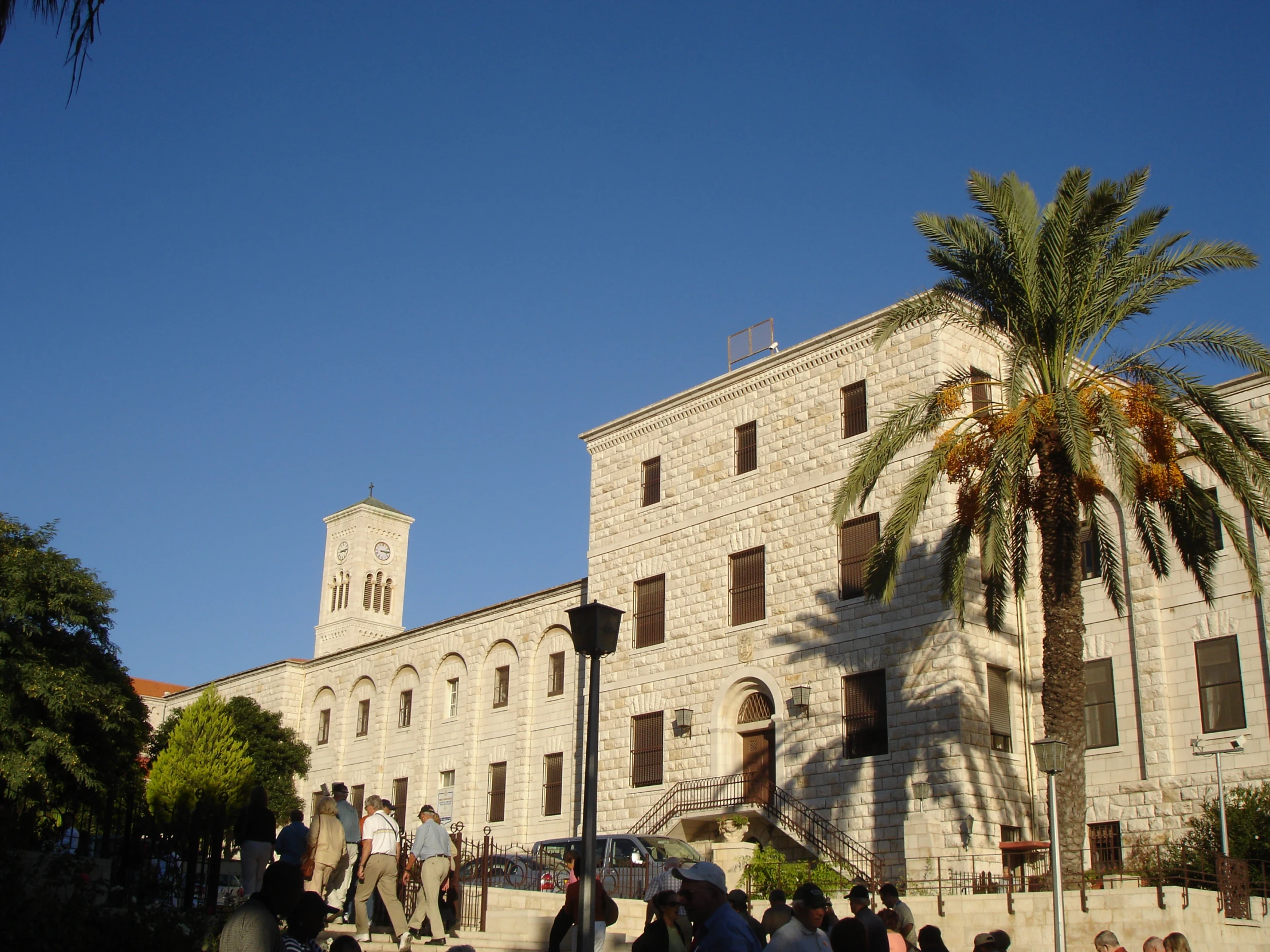 a crowd gathered outside the palace of alexandria