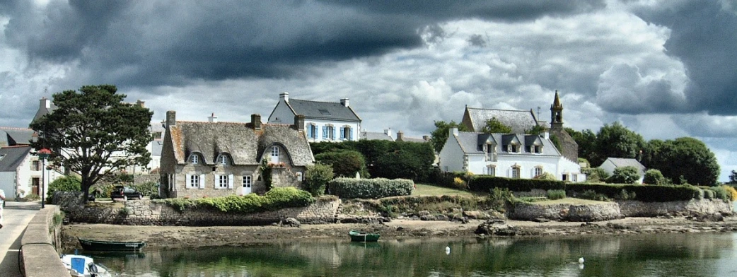 a river near the shore and houses