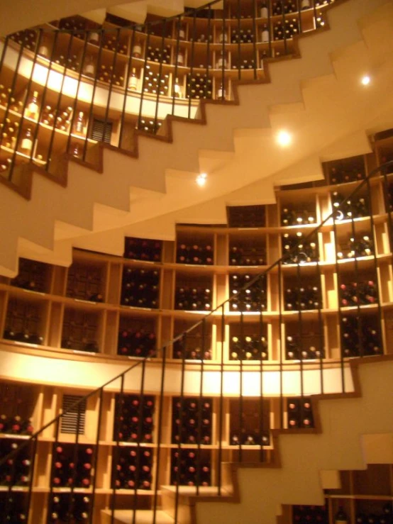 an artistic stairway and glass windows in a wine cellar