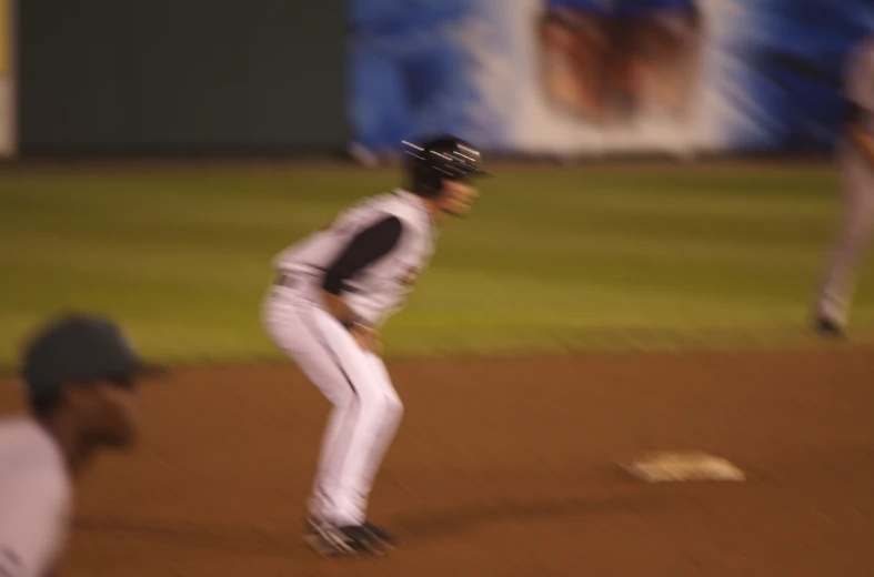 a baseball player standing on top of a field