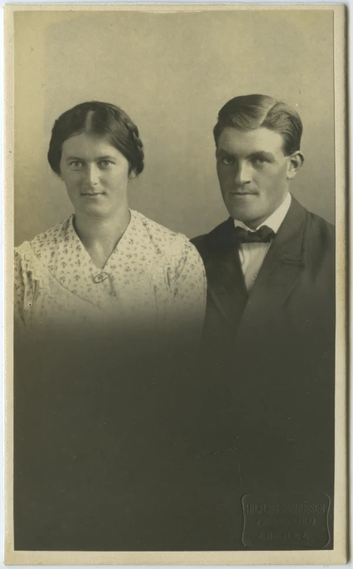 two people are in an old po with a black and white background