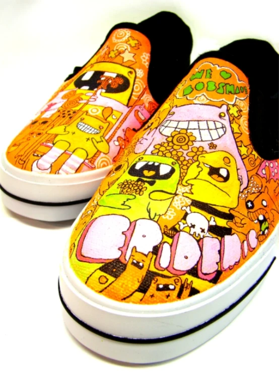 a pair of vans shoes painted to look like homer from the simpsons