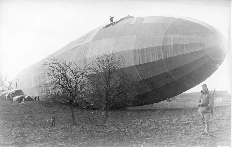 a large inflated object being carried by two people