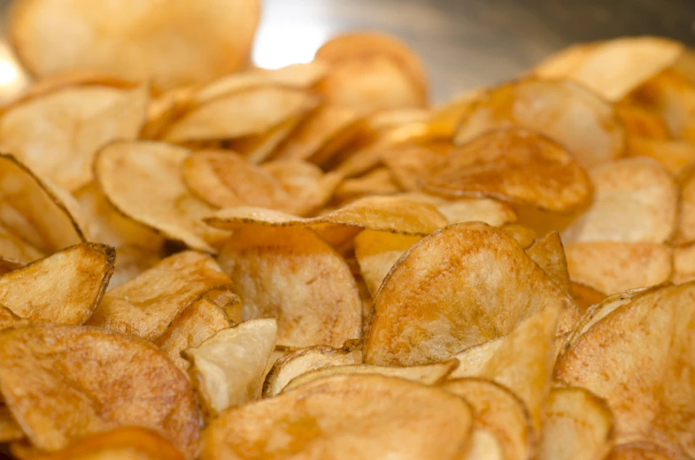 a bunch of fried golden potato wedges