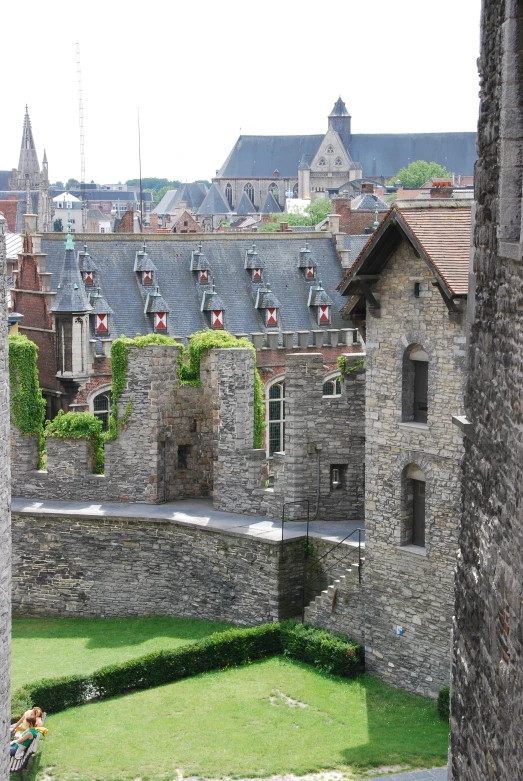 a large building with many windows and some buildings