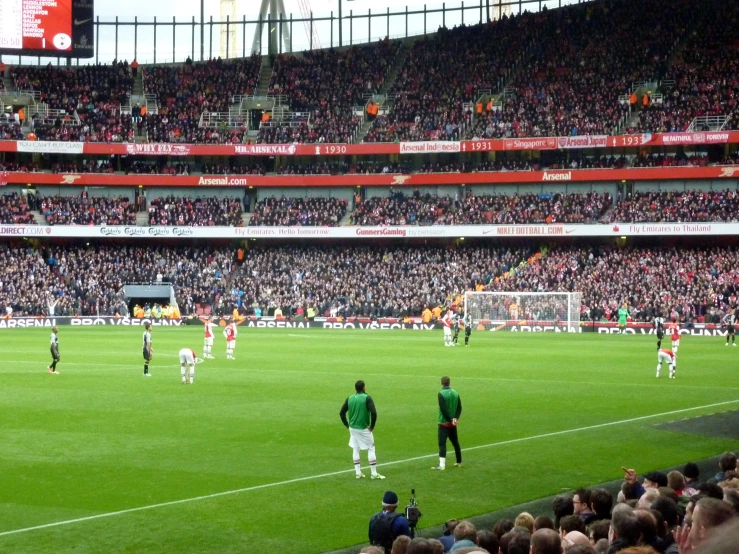 spectators watching a soccer game from the stands