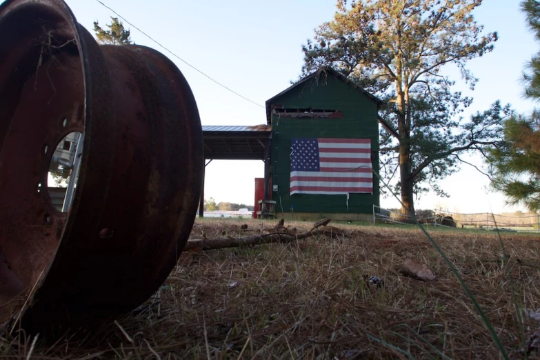 two large metal spools that are sitting in a field