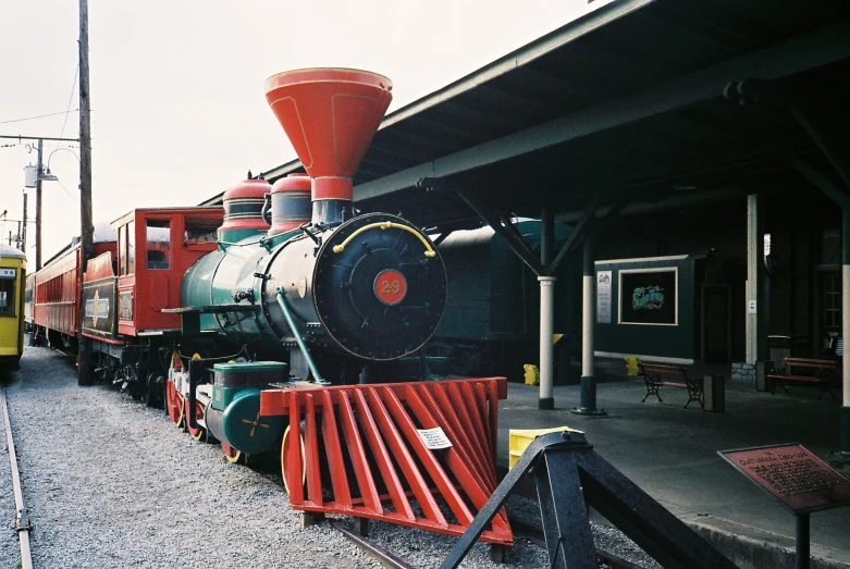 a red train is in front of a yellow train