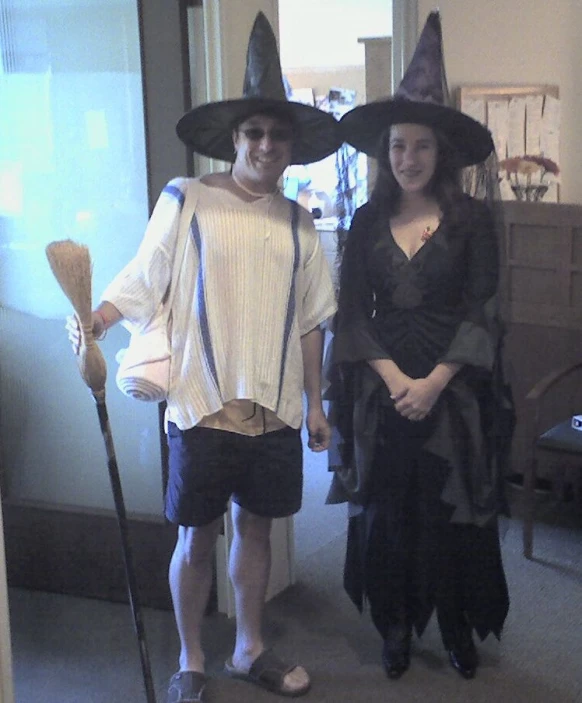 the two people are dressed as witches for halloween