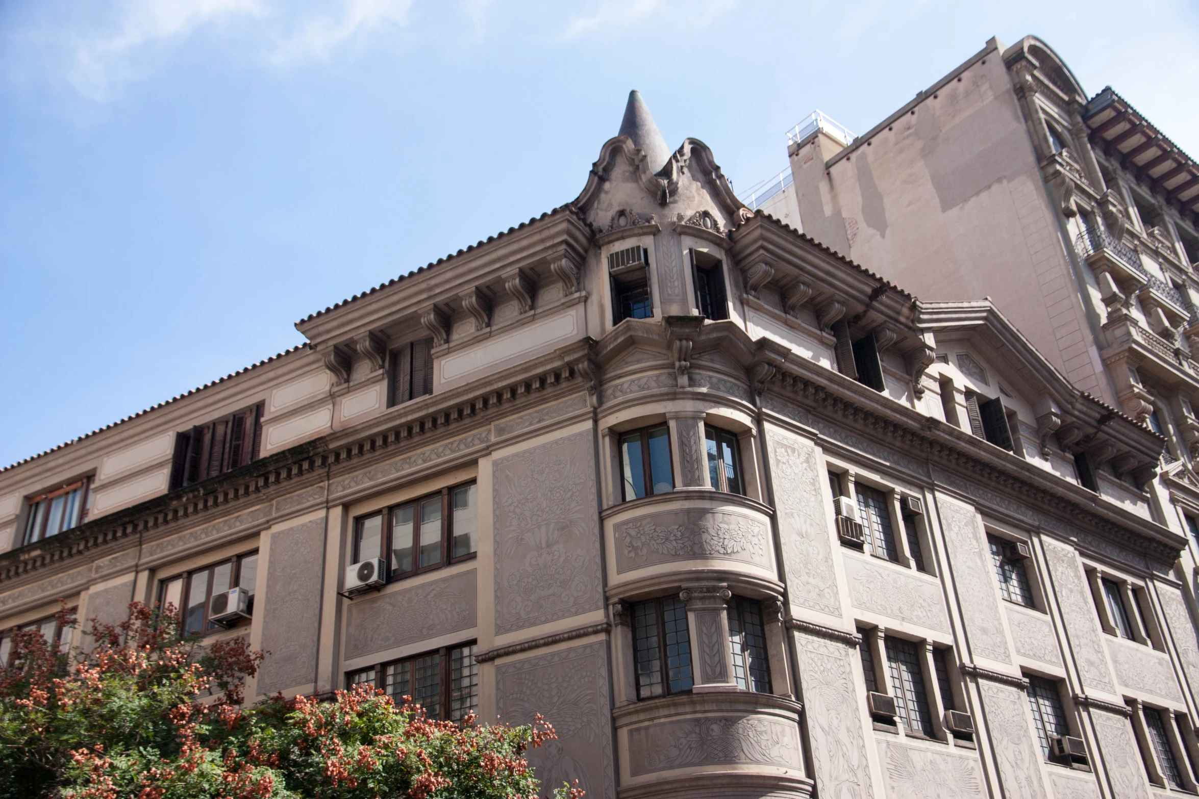 the top of an old building with several windows