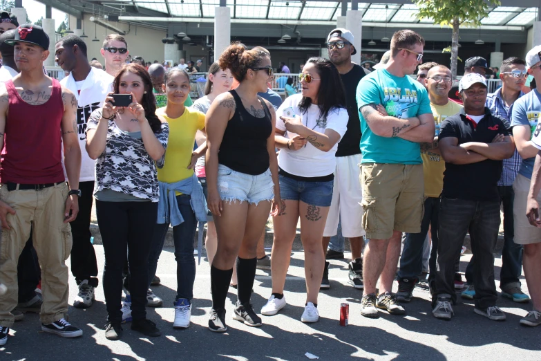 a group of people stand in a circle and take pos