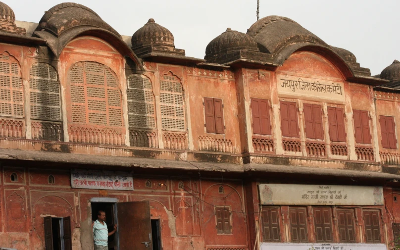 a person is standing in the doorway of an old building