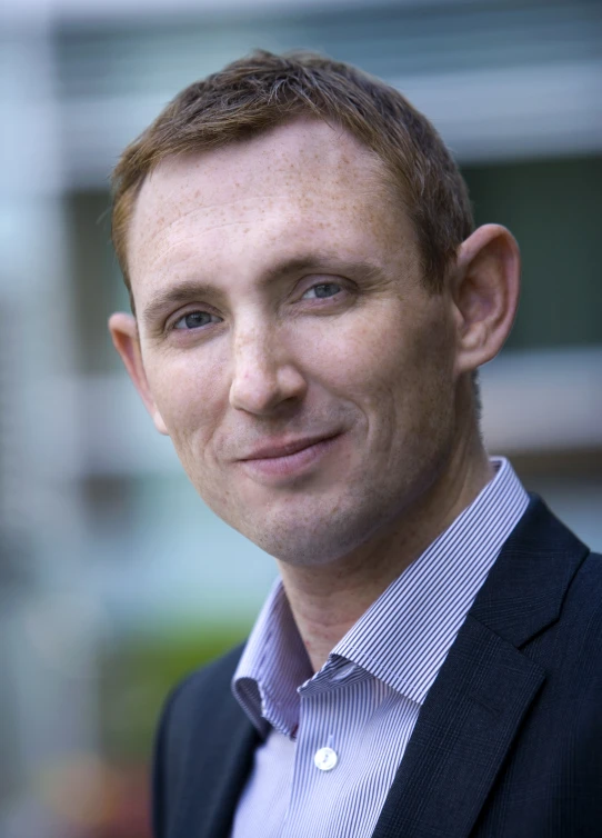 a man wearing a blue and white striped shirt