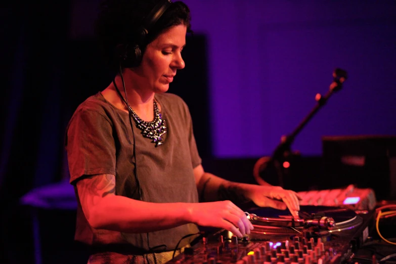 woman using a controller on the front of her mixing unit