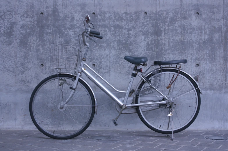 a bike that is locked up against the wall