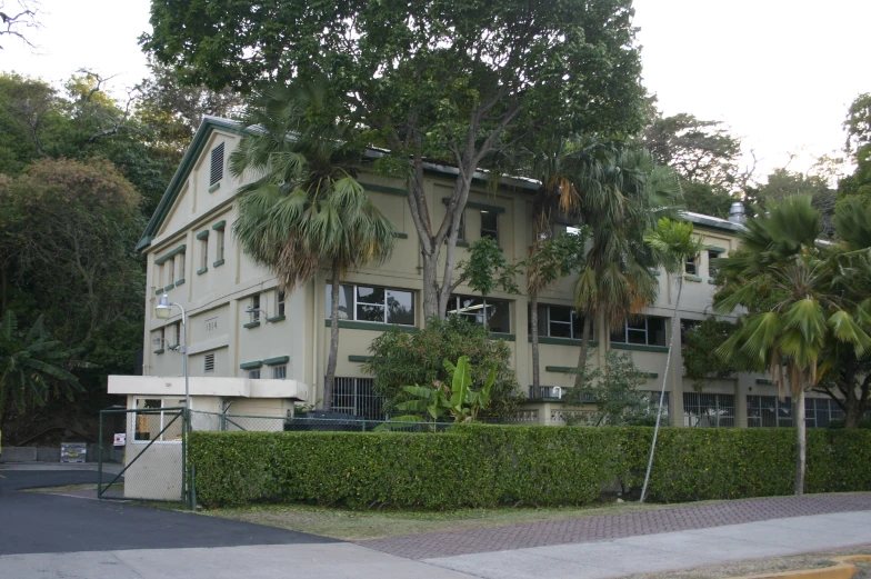 a large house with a large fence around it