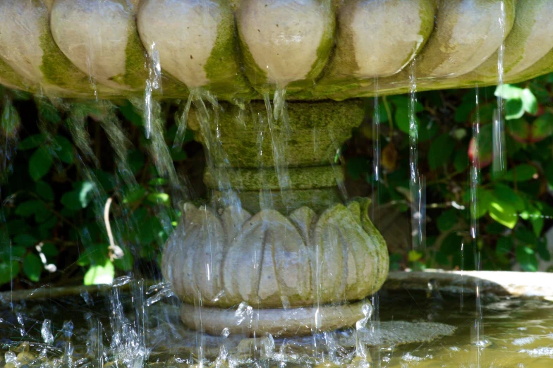 a fountain with water running down it is in the center