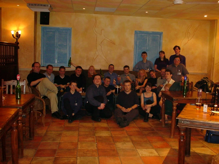 a group of people sitting around some chairs