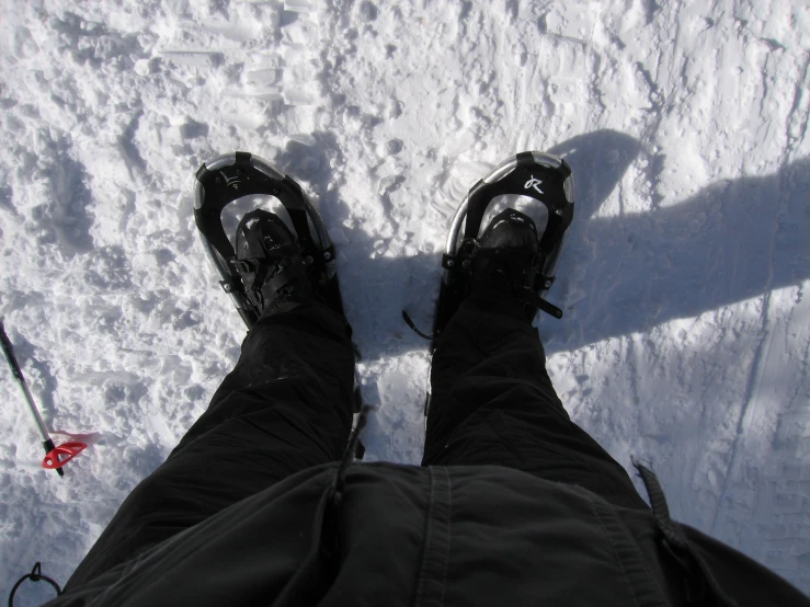 the view of a man with his feet on skis