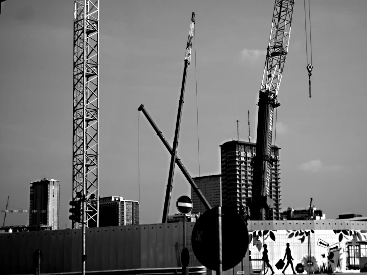 construction cranes on a roof of a building