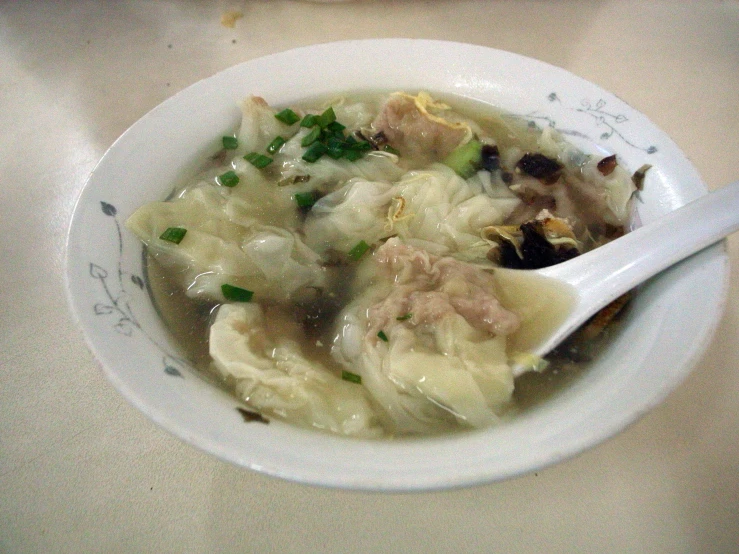 a bowl of a soup is sitting on the table