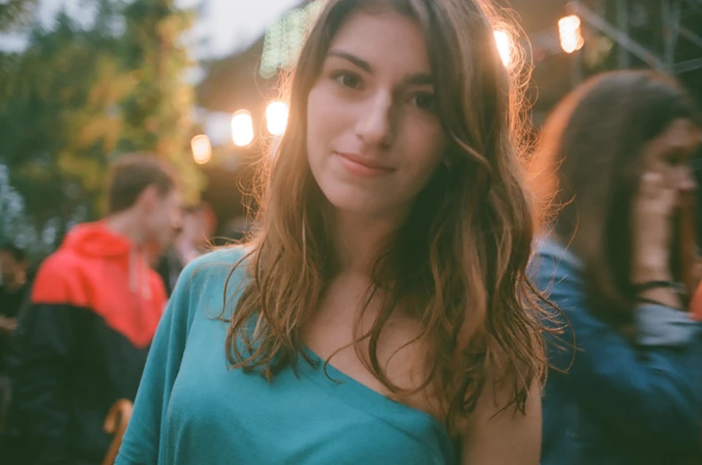 a close up of a person wearing a green shirt