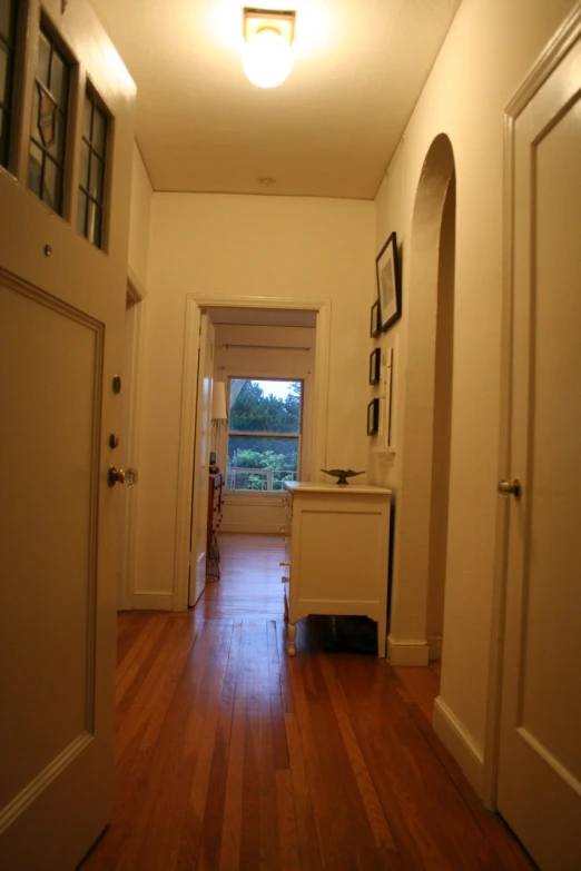 the hallway leading up to the patio of a house