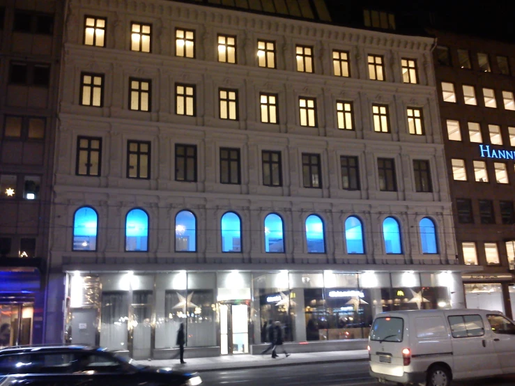 an image of the illuminated facade of a el at night