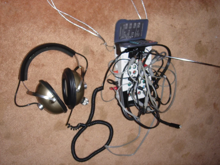 headphones and corded cord on the floor