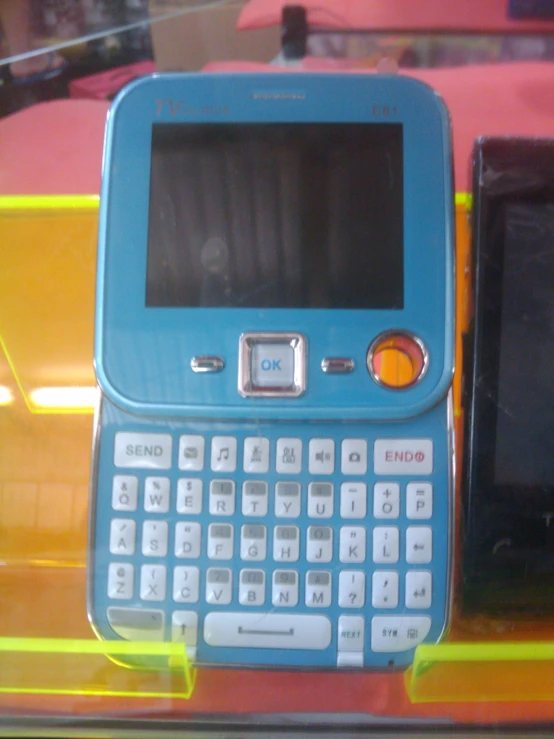 there is an old blue nokia cell phone in this case