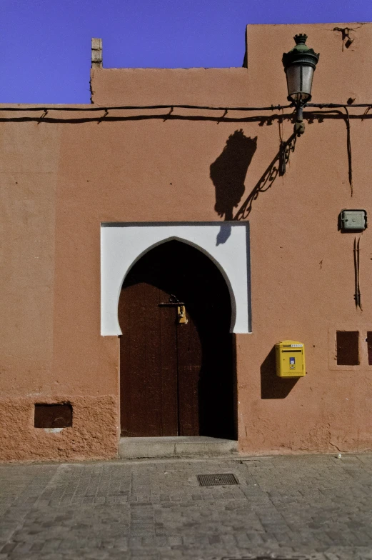 a building has a clock tower and a door