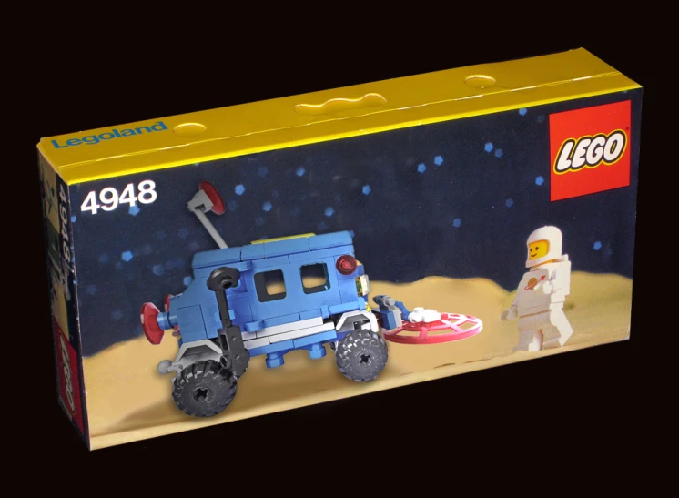 a lego box has an astronaut on top of it