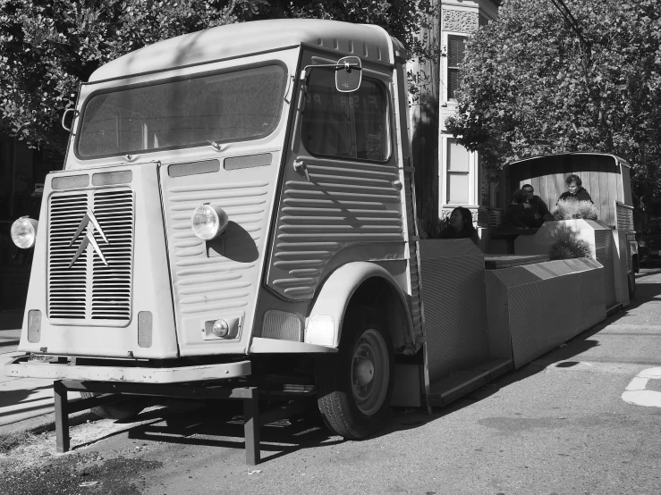 a large old semi truck on the side of the road