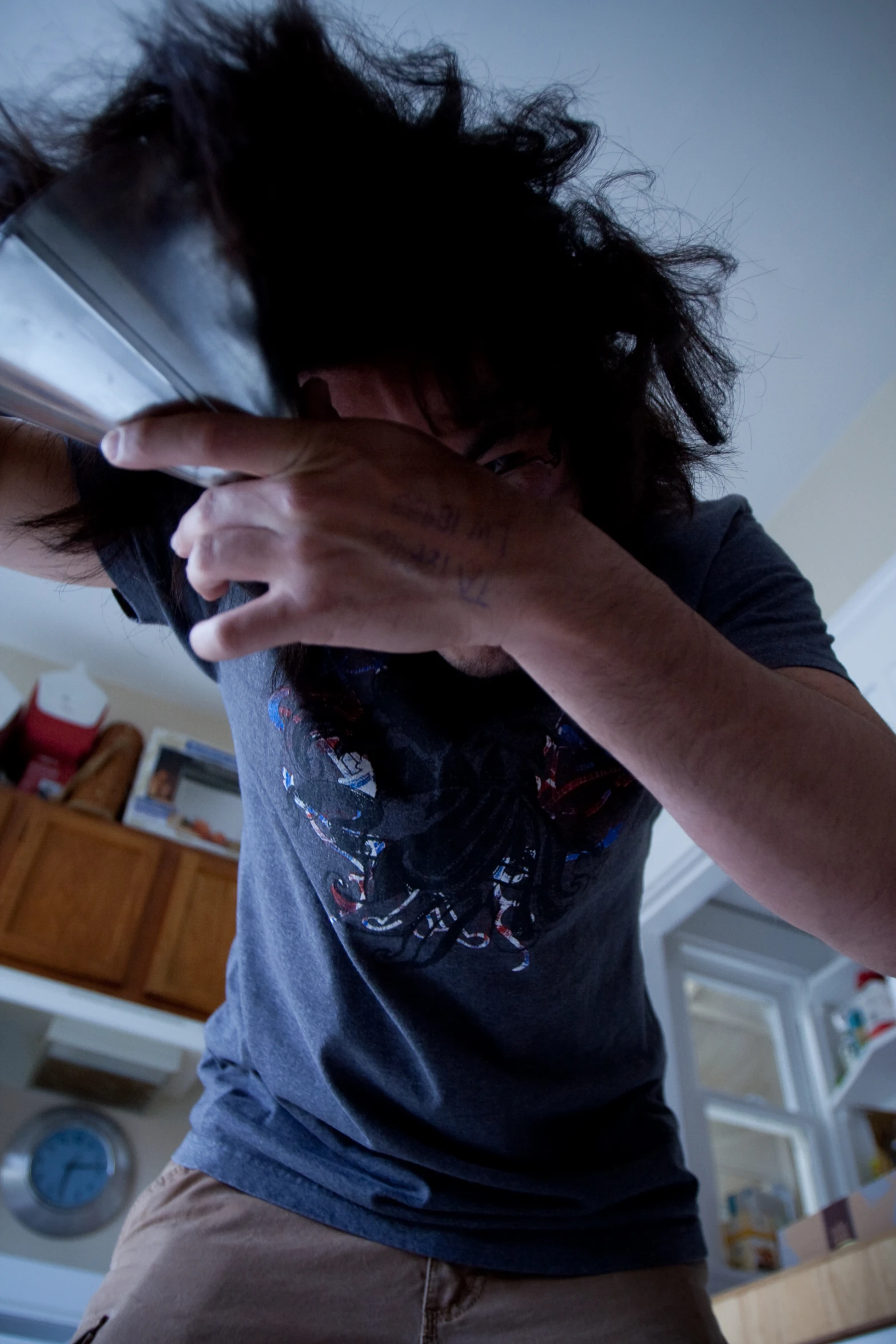 the girl brushes her long hair with an object