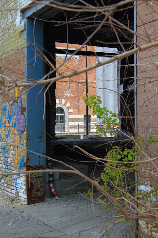 a rundown building with graffiti on the walls