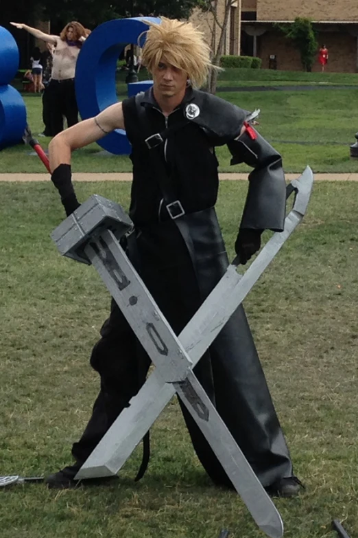 a guy with some kind of costume posing with a sword