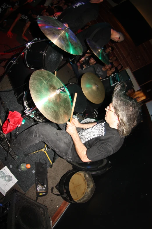 a drummer plays his instruments at a concert