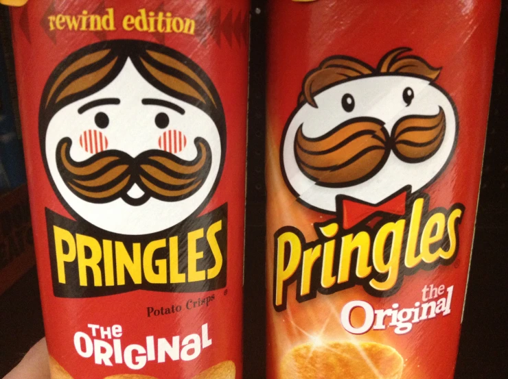 two packages of pringles sitting on top of each other