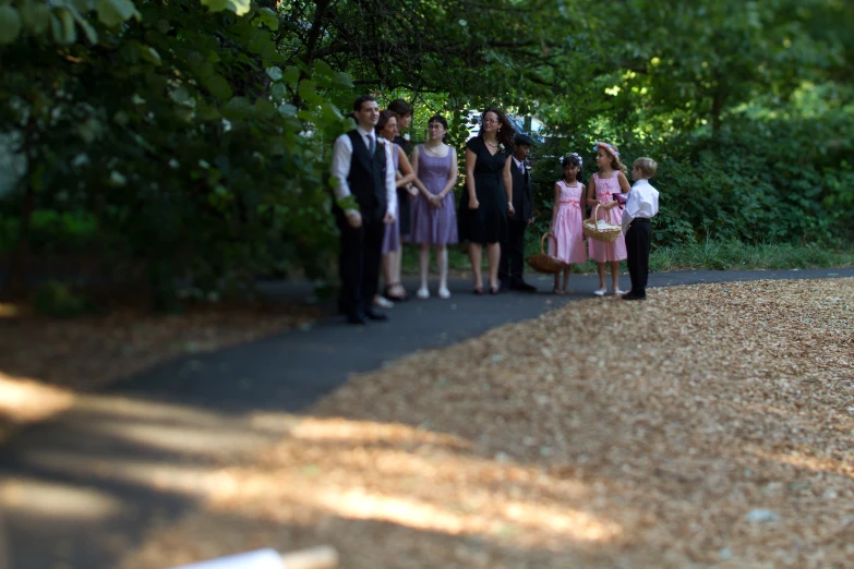 a bunch of people that are standing in the dirt